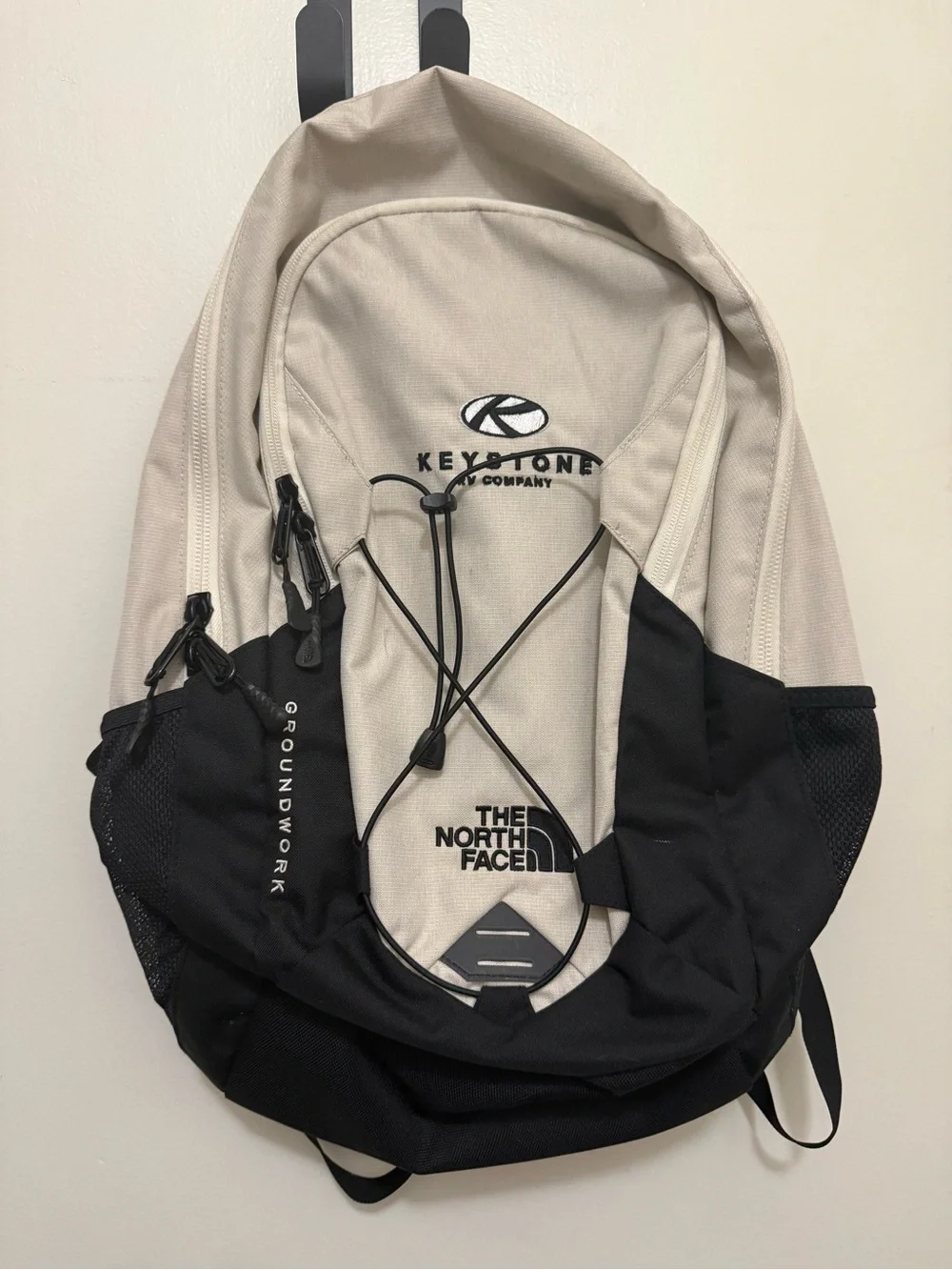 The North Face Two-Tone Beige and Black Backpack with Bungee Front